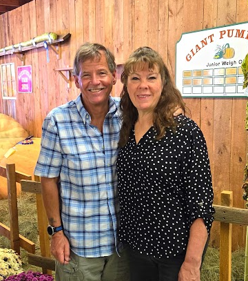 David Grant and his wife at a fair.