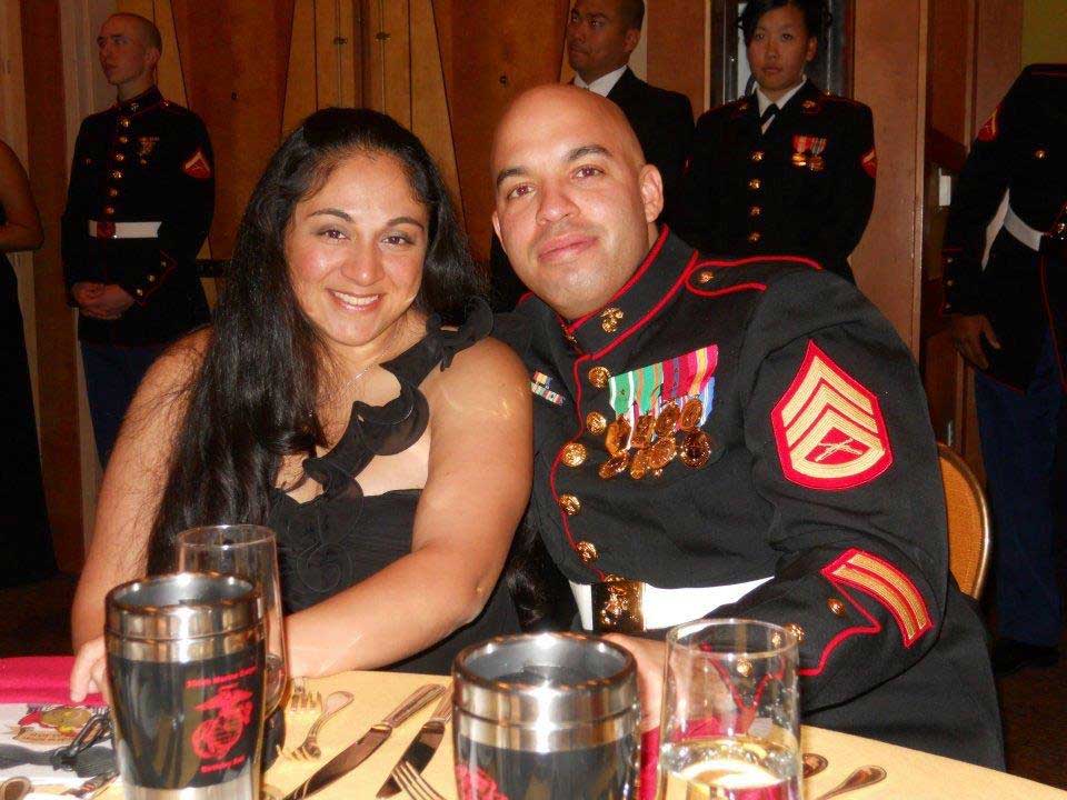 A Photo of Heidi, wearing a black ball gown, and her husband, Luis Agostini, wearing Marine dress uniform, at the Marine Corps Birthday Ball. Photo courtesy of Heidi Agostini