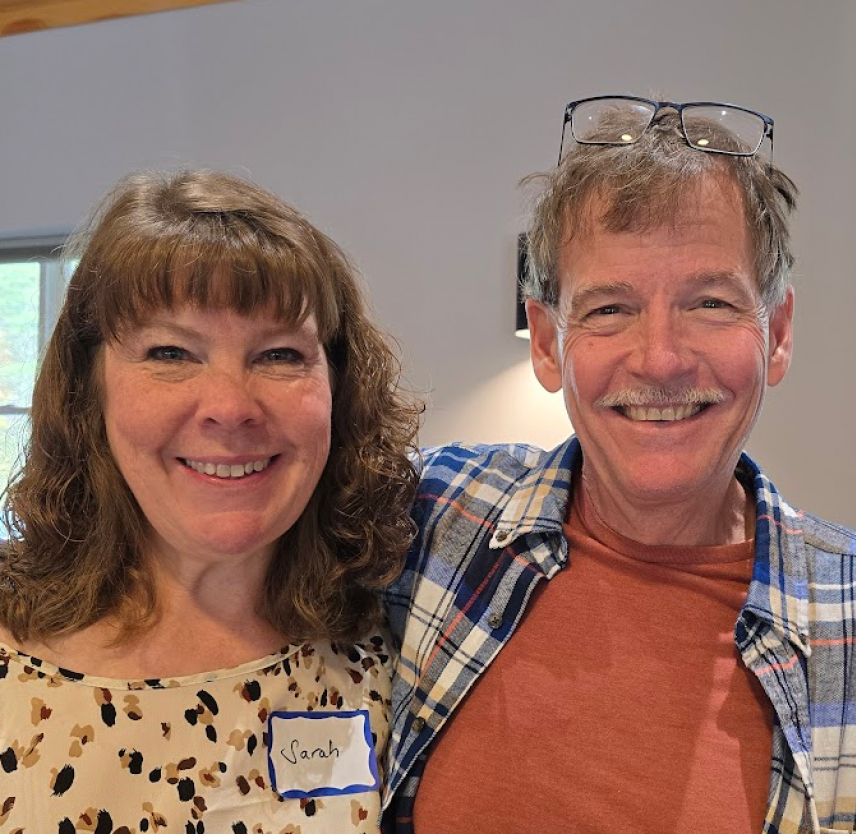 David Grant and his wife smiling into the camera