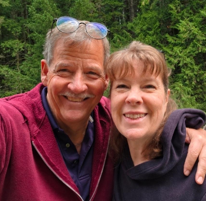 David and his wife smiling at the camera.