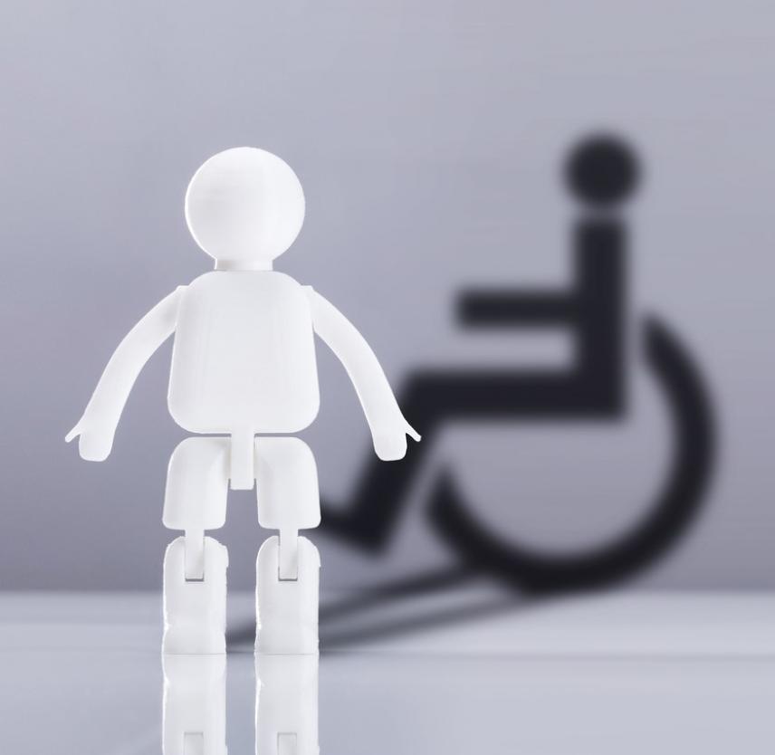Graphic representation of a white figurine standing in front of a disabled wheelchair symbol in black