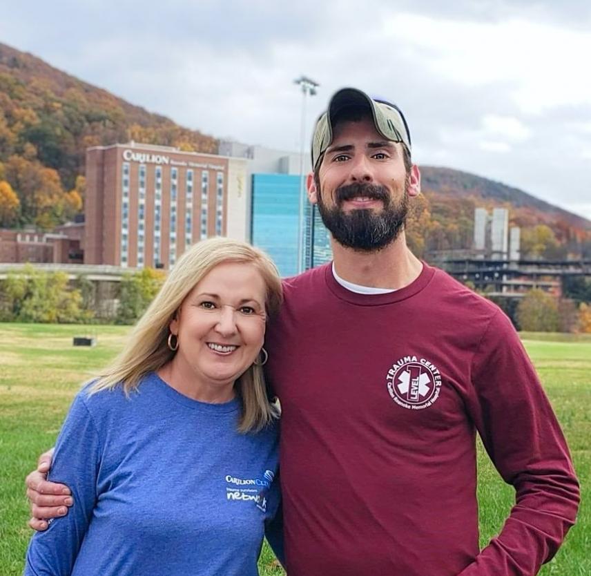 Norma and Steven smiling in front of Carilion Roanoke Memorial Hospital