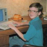 Photo of Adam at a computer