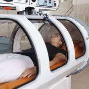 Woman getting hyperbaric oxygen therapy treatment. 