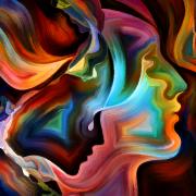 Swoops of bright colors blending to show two heads in profile.