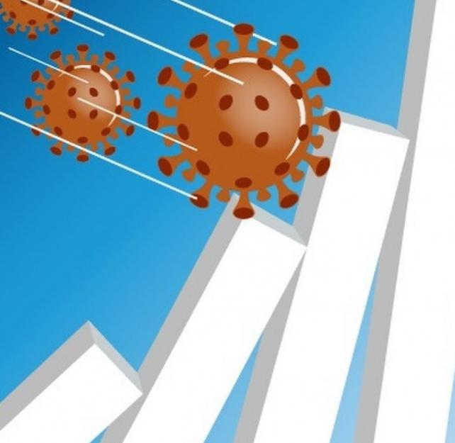 Graphic representation of a coronavirus knocking over white walls