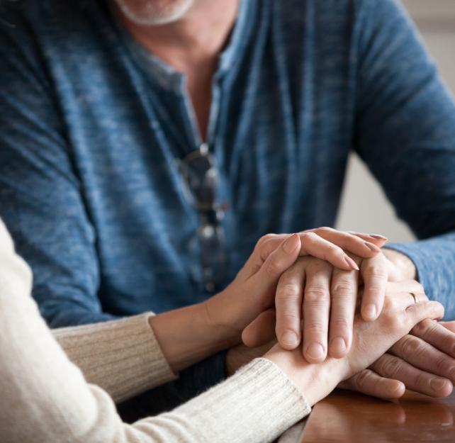 two people holding hands