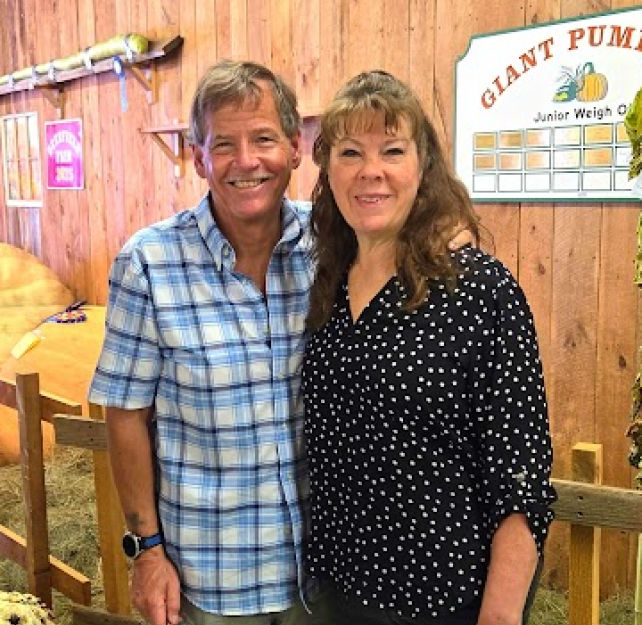 David Grant and his wife at a fair.