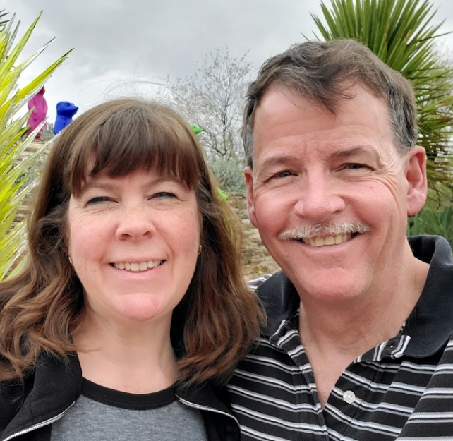 David and his wife smiling at the camera