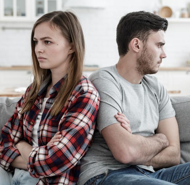 couple with backs to each other