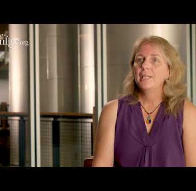 Michelle Ranae Wild in front of silver silos.